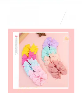 Macro detail of assorted pastel grosgrain ribbon bows for hair accessories and decor