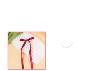 Detail of burgundy satin ribbon bow showing smooth polyester material texture