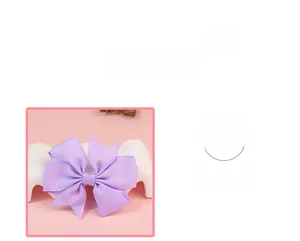 Detailed view of lavender grosgrain ribbon hair bow with layered texture and soft finish
