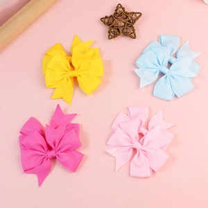 Handmade grosgrain ribbon bows in four colors for hair accessories and DIY crafts