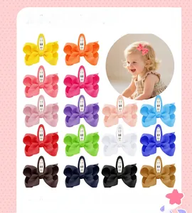 Collection of colorful 7cm ribbed fabric bow hair clips for girls in sixteen vibrant colors