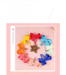 Flat lay of colorful 7cm ribbed grosgrain ribbon bow hair clips in a circular arrangement