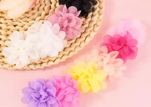 Close-up of handmade multi-color chiffon flowers for DIY hair clips and clothing
