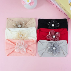 6-pack elastic baby headbands with handmade 3D tulle flowers and pearls on pink background