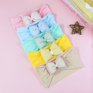 Five-pack of cotton baby headbands with large checkered bowknots in assorted pastel colors