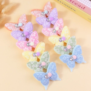 Handmade lace butterflies with rhinestones and plush balls for DIY crafts and hair accessories