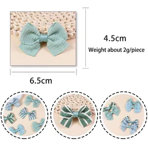 Handmade green fabric plaid bow accessory for hair and crafts, size 6.5cm by 4.5cm