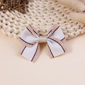 Detail of elegant striped fabric double-layered bow for DIY hair accessories and crafts