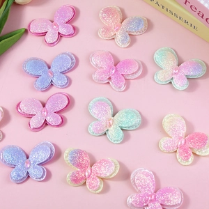 Glitter butterfly hair accessory components with layered fabric and centered crystal stone