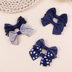 Handmade plaid fabric bow accessories in navy lace and tweed for hair and clothing