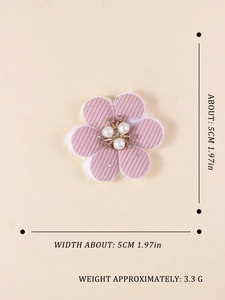 Detail showing 5cm pink corduroy fabric flower with pearls and rhinestones