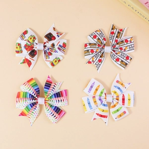 Set of four school themed hair bows with colorful pencil and bus prints for kids