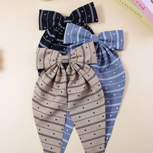 Elegant oversized ribbon bow hair clips with stripes and polka dots in three colors