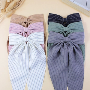 Striped bow hair clips with long streamers in six colors including cream and navy blue