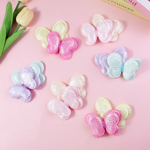 Glittery multi-layered butterfly hair accessories in pastel colors with pearlescent finish
