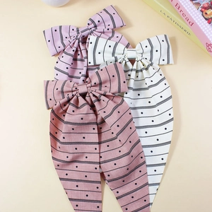 Three-piece set of striped polka dot bow hair clips with long ribbons in pastel colors