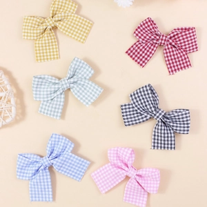 Colorful checkered bow hair accessories in multiple vibrant patterns for DIY projects