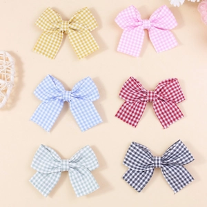 Set of six colorful checkered fabric bow hair accessories in various pastel colors