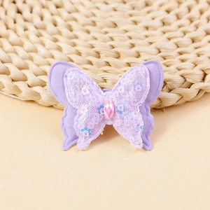 Detail view of double-layer lavender sequin butterfly patch with small floral embroidery