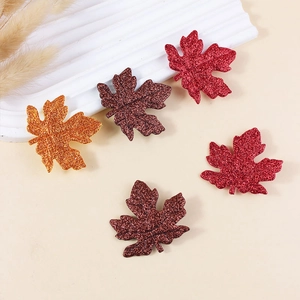 Sparkly maple leaf hair clips in autumn colors for Thanksgiving hair decoration