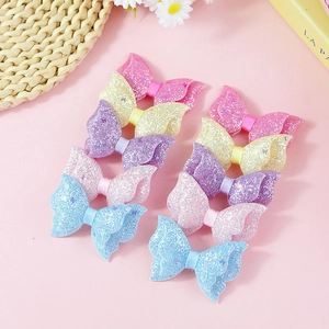 Set of 10 glitter bow hair clips for girls in assorted pastel colors and glossy finish