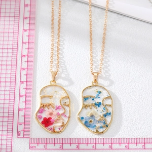 Face profile pendant necklace with real dried flowers in gold metal frame