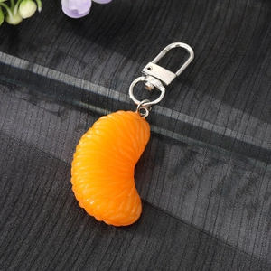 Realistic orange slice keychain with vibrant pulp texture and silver metal ring accessory