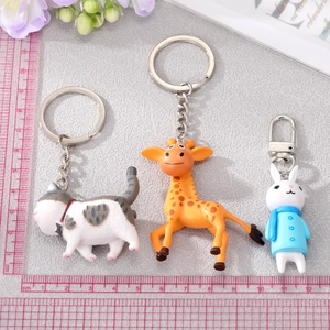 Detailed view of cute resin animal keychains with scale ruler for size reference