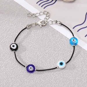 Bohemian Evil Eye bead bracelet with adjustable black cord and colorful Nazar charms