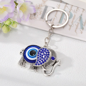 Vintage elephant evil eye keychain with blue rhinestones and silver metal ring