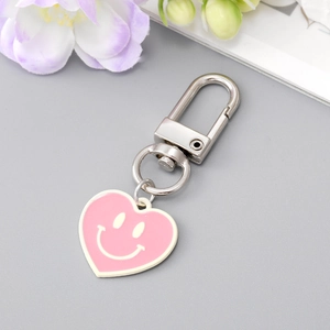 Porte-clés cœur rose avec visage souriant et clip en métal argenté pour sac à main mignon