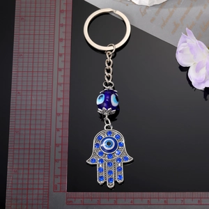 Vintage Hamsa Hand and Evil Eye metal keychain with blue rhinestones and size scale detail
