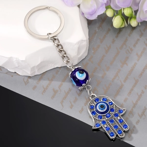 Vintage silver Hamsa Hand keychain with blue evil eye pendant and sparkling rhinestones