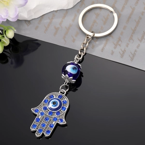 Vintage silver Hamsa hand keychain with blue evil eye beads and rhinestones