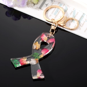 Bow-shaped clear resin keychain with real dried flowers and golden lobster clasp hardware