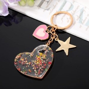 Porte-clés cœur en acrylique transparent avec fleurs séchées colorées et breloques