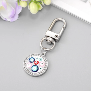Silver evil eye heart keychain with colorful enamel pendants and sparkling rhinestones