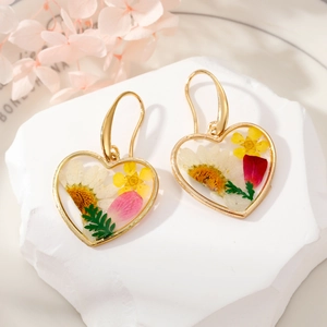 Handmade clear resin heart earrings with real dried flowers and gold metal hooks