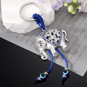 Vintage elephant keychain with blue rhinestones and evil eye beads on silver alloy