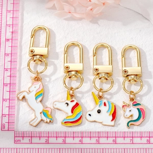 Cartoon unicorn keychains set in colorful designs with golden lobster clasps