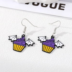 Detail of purple cupcake earrings with white bat wings for Halloween theme