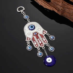 Bohemian Hamsa Hand and Evil Eye metal keychain with intricate blue and red enamel details