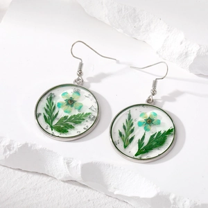 Minimalist silver earrings with real green dried flowers and silver foil in clear resin