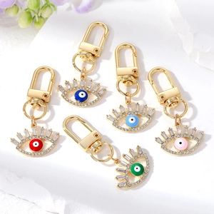 Luxury Alloy Rhinestone Evil Eye Keychain Boho Ethnic Hollow Eye Bag Charm Gold Plated Eyelash Pendant Keyring Jewelry
