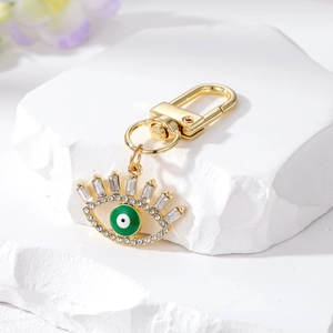 Exquisite gold-plated evil eye keychain with sparkling zircons and green enamel finish