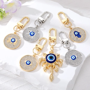 Porte-Clés Créatif Mauvais Œil en Alliage Strass Flamme Éléphant Main de Fatma Pendentif Sac Style Ethnique Bijoux Cadeau