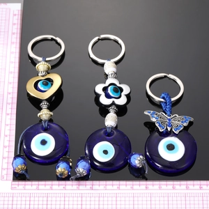 Porte-clés œil maléfique bohème avec cœur, fleur et papillon en cristal argent