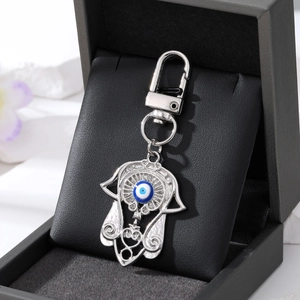 Hamsa-Hand-Schlüsselanhänger mit blauer Evil Eye Perle in Geschenkbox