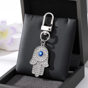 Silberner Hamsa-Hand-Schlüsselanhänger mit Strass und blauem bösen Blick für Taschen