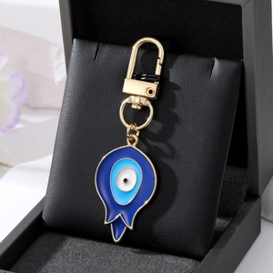 Vintage teardrop Evil Eye keychain with blue enamel and gold-tone spring clasp